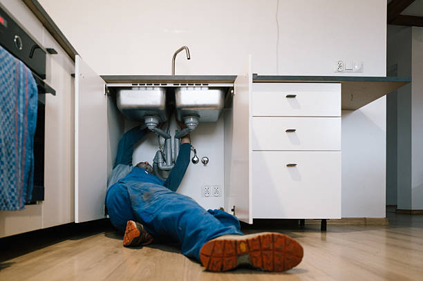 Professional Drain Cleaning technician working in Laconia, NH